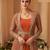Rust orange chinon silk anarkali jacket suit with heavy zari, thread and sequins work, free-size stitched.