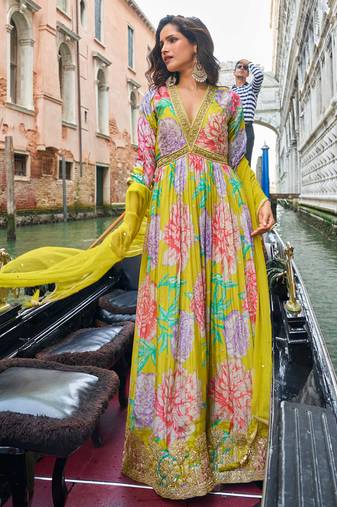 Bright lime green chinon silk anarkali gown suit with intricate zari and sequins embroidery, free-size stitched.