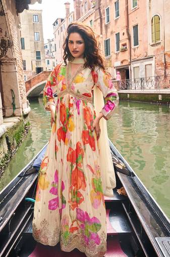 Cream chinon silk anarkali gown suit with intricate zari and sequins embroidery, free-size stitched.