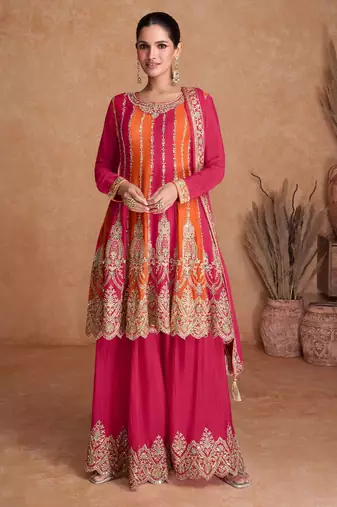 Pink-orange chinon straight long top palazzo suit with heavy gold zari, resham thread & sequins, free-size stitched.
