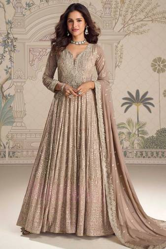 Beige georgette anarkali gown suit with heavy embroidery, sequins, thread, seroski & zarkan, free-size stitched.