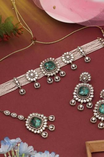 Elegant green color choker kundan necklace set crafted for timeless festive beauty