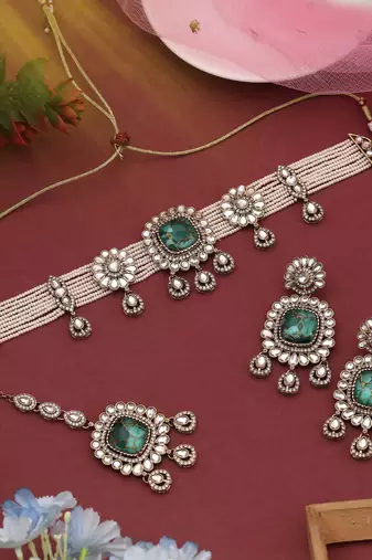 Elegant green color choker kundan necklace set crafted for timeless festive beauty