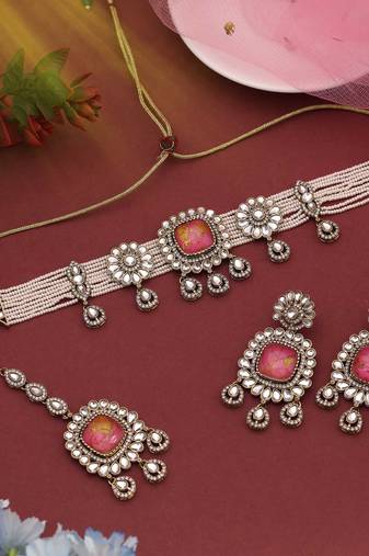Stunning rani color choker kundan necklace set offering a royal and graceful appearance