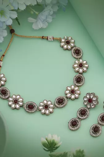 Traditional maroon color kundan necklace set created for sophisticated ethnic fashion lovers
