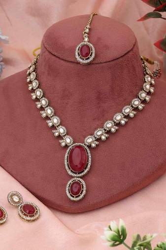 Bright red color kundan necklace set crafted for classic bridal and festive traditions