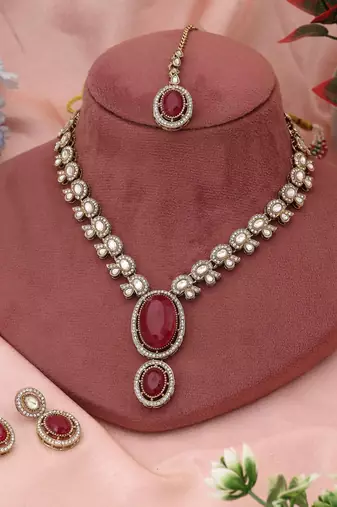 Bright red color kundan necklace set crafted for classic bridal and festive traditions
