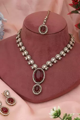 Radiant rani color kundan necklace set offering bold beauty for cultural celebrations