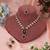 Radiant rani color kundan necklace set offering bold beauty for cultural celebrations