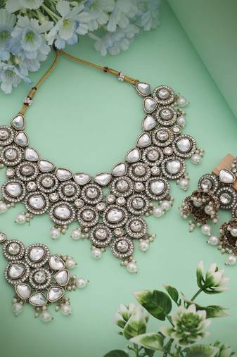 Pristine white color kundan necklace set offering refined elegance for every special event