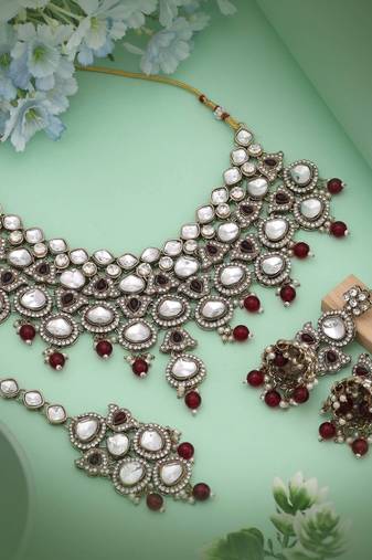 Elegant maroon color kundan necklace set crafted for premium traditional fashion lovers