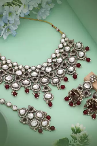 Elegant maroon color kundan necklace set crafted for premium traditional fashion lovers