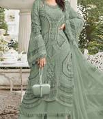 Green georgette semi stitched suit with embroidery sequence & moti work