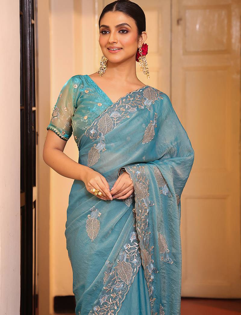 sky blue color tissue fabric embroidery work partywear saree