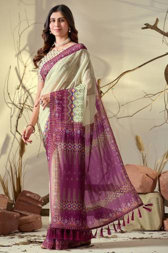 cream georgette saree with pink geometric print border & tassel detailing with blouse