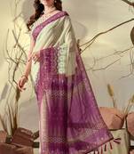 cream georgette saree with pink geometric print border & tassel detailing with blouse