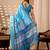 Serene sky blue lichi silk saree with lotus digital prints & golden zari border | matching contrast satin silk blouse