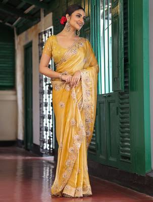 yellow embroidery work tissue ceremonial saree 4