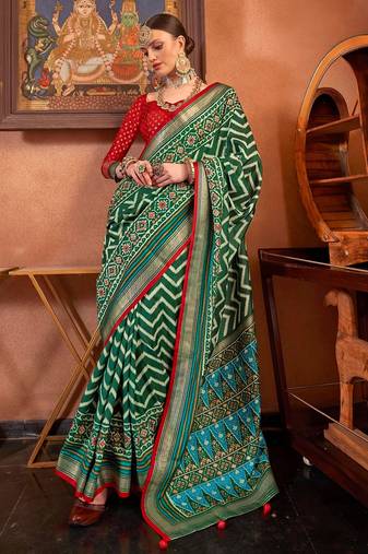 green patola silk blend saree with traditional motifs & zari/contrast border | unstitched blouse