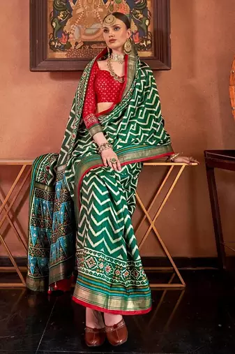 green patola silk blend saree with traditional motifs & zari/contrast border | unstitched blouse