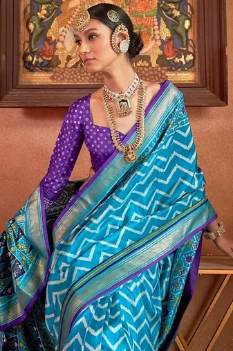 sky  blue patola silk blend saree with traditional motifs & zari/contrast border | unstitched blouse