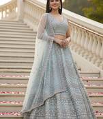 Mesmerizing Sky Handwork Crystal Pipe, Handwork Beads, Sequins and Dori Embroidered Net Wedding Lehenga Choli
