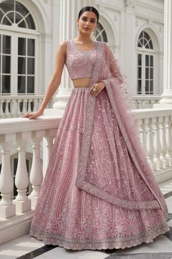 Entrancing Baby Pink Dori, Multi Thread, Sequence Embroidered and Zircon Diamond Heavy Net Wedding Lehenga Choli