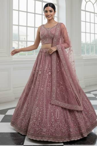Enthralling Pink Dori, Multi Thread, Sequence Embroidered and Zircon Diamond Heavy Net Bridal Lehenga Choli