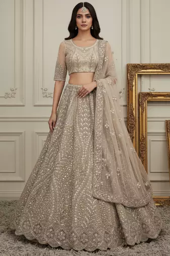Mesmerizing Golden Dori, Zari, Thread,Sequence Embroidered and motif work Heavy net bridal wear lehenga choli