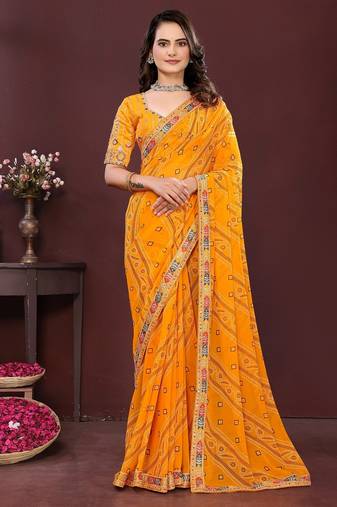 yellow color georgette fabric bandhej printed traditional saree