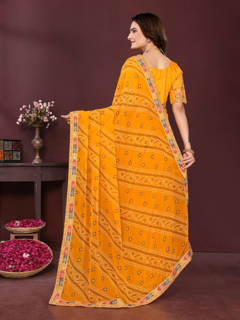 yellow color georgette fabric bandhej printed traditional saree