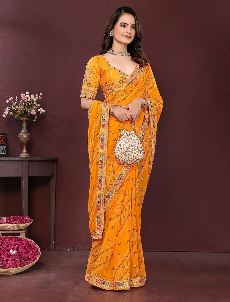 yellow color georgette fabric bandhej printed traditional saree