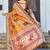 orange color silk blend blended traditional bandhani ajrakh printed saree