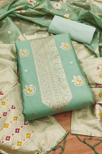 green zari woven banarasi dress materials