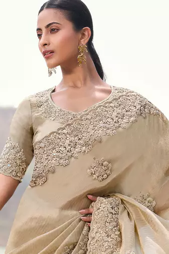 beige tissue silk blend blend heavy thread embroidered with sequins work saree with blouse