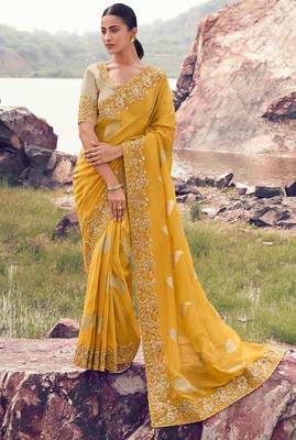 yellow tissue silk blend blend jacquard woven with embroidered border saree with blouse 1