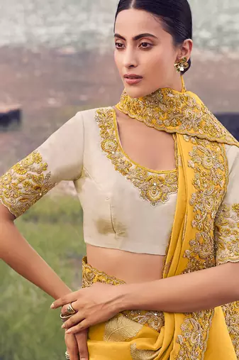 yellow tissue silk blend blend jacquard woven with embroidered border saree with blouse