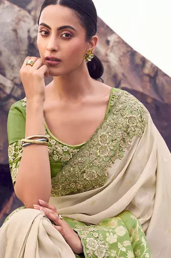 cream & green tissue silk blend blend jacquard woven with embroidered border saree with blouse