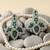 Silver polish bridal necklace set with green doublets & cz stones