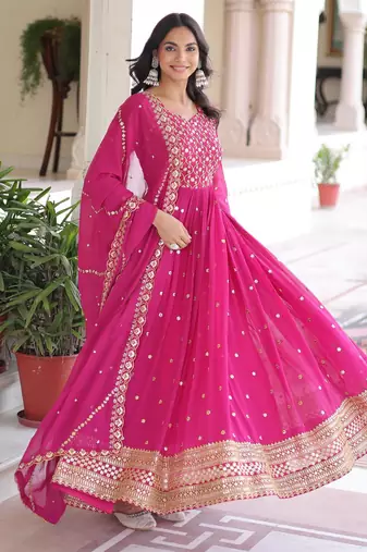 Pink faux georgette sequins & zari embroidered flared gown with heavy dupatta