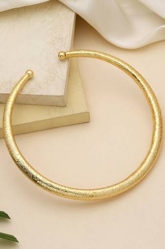 Gold color amrapali hansli necklace crafted with traditional detailing for elegant festive wear