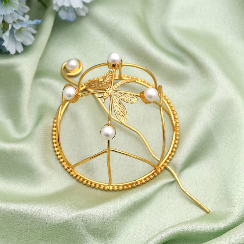Stylish gold color hair pin designed to add graceful charm to ethnic hair fashion