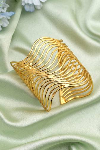 Gold color bracelet crafted with elegant traditional detailing for timeless festive and wedding wear