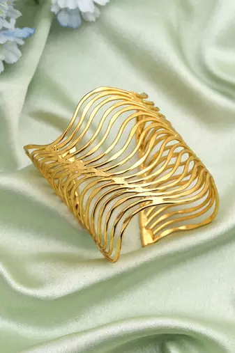 Gold color bracelet crafted with elegant traditional detailing for timeless festive and wedding wear