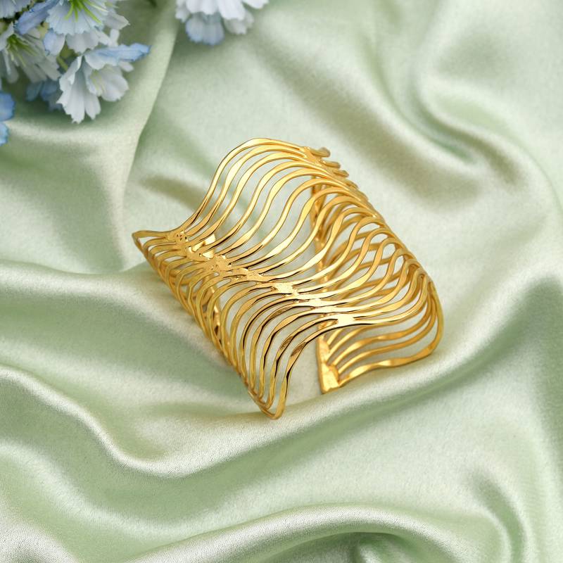 Gold color bracelet crafted with elegant traditional detailing for timeless festive and wedding wear