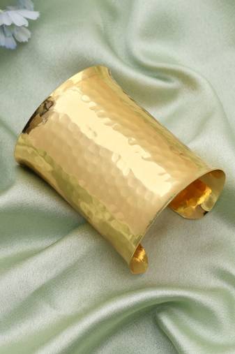 Gold color bracelet featuring intricate patterns perfect for elevating traditional fashion effortlessly