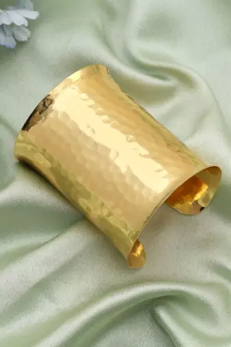 Gold color bracelet featuring intricate patterns perfect for elevating traditional fashion effortlessly