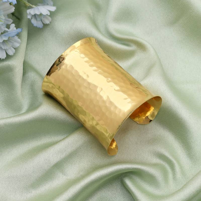 Gold color bracelet featuring intricate patterns perfect for elevating traditional fashion effortlessly