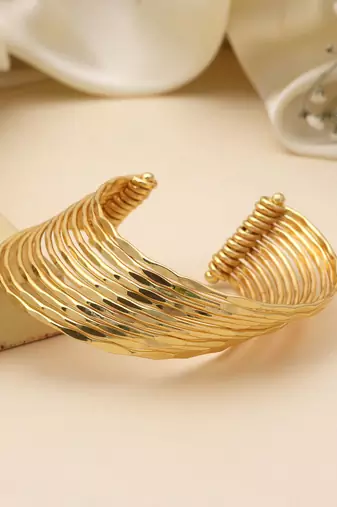 Charming gold color bracelet perfect for adding sophisticated glow to every traditional celebration