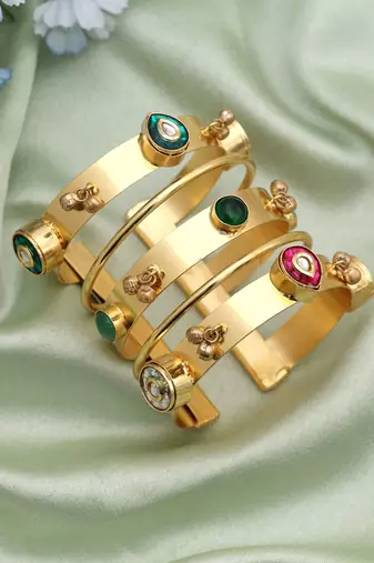 Gold color bracelet designed for graceful ethnic styling with a luxurious classic aesthetic